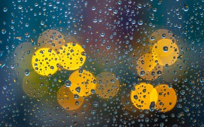 Wassertropfen und gelbe Lichtpunkte